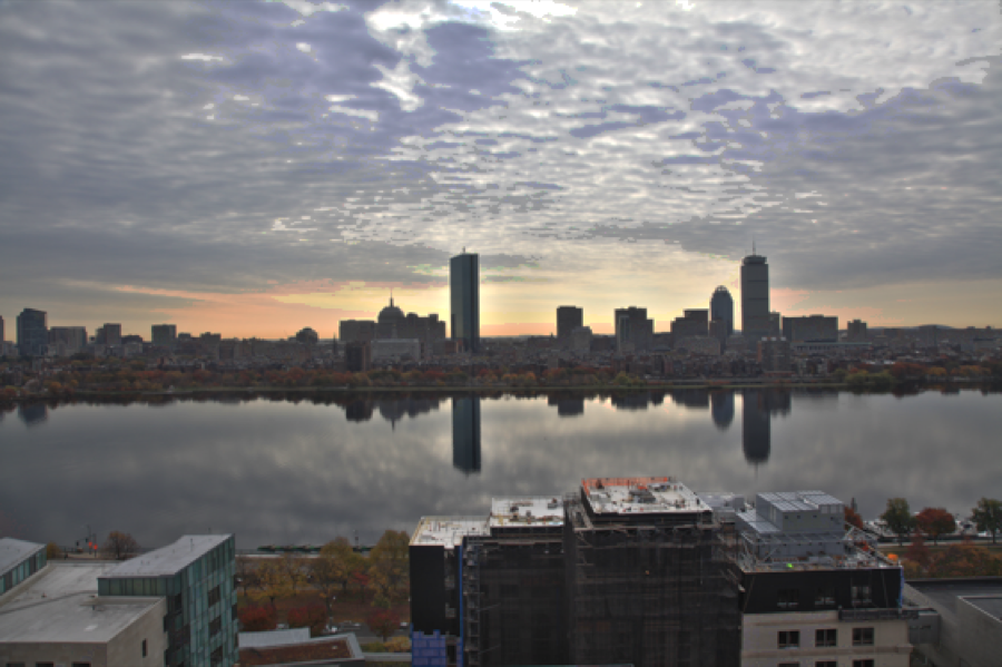 Tone mapping of the `boston` image sequence using the parameters provided in `testToneMapping_boston`. (a) Gaussian Tone Mapping